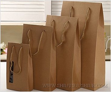Custom Kraft paper gift bag with handles with logo design.